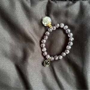 Purple Beaded Bracelet with Smiley Charm